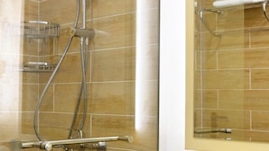 A bathroom with a shower, a sink, and a mirror. - Bilyana Beach (Nesebar)