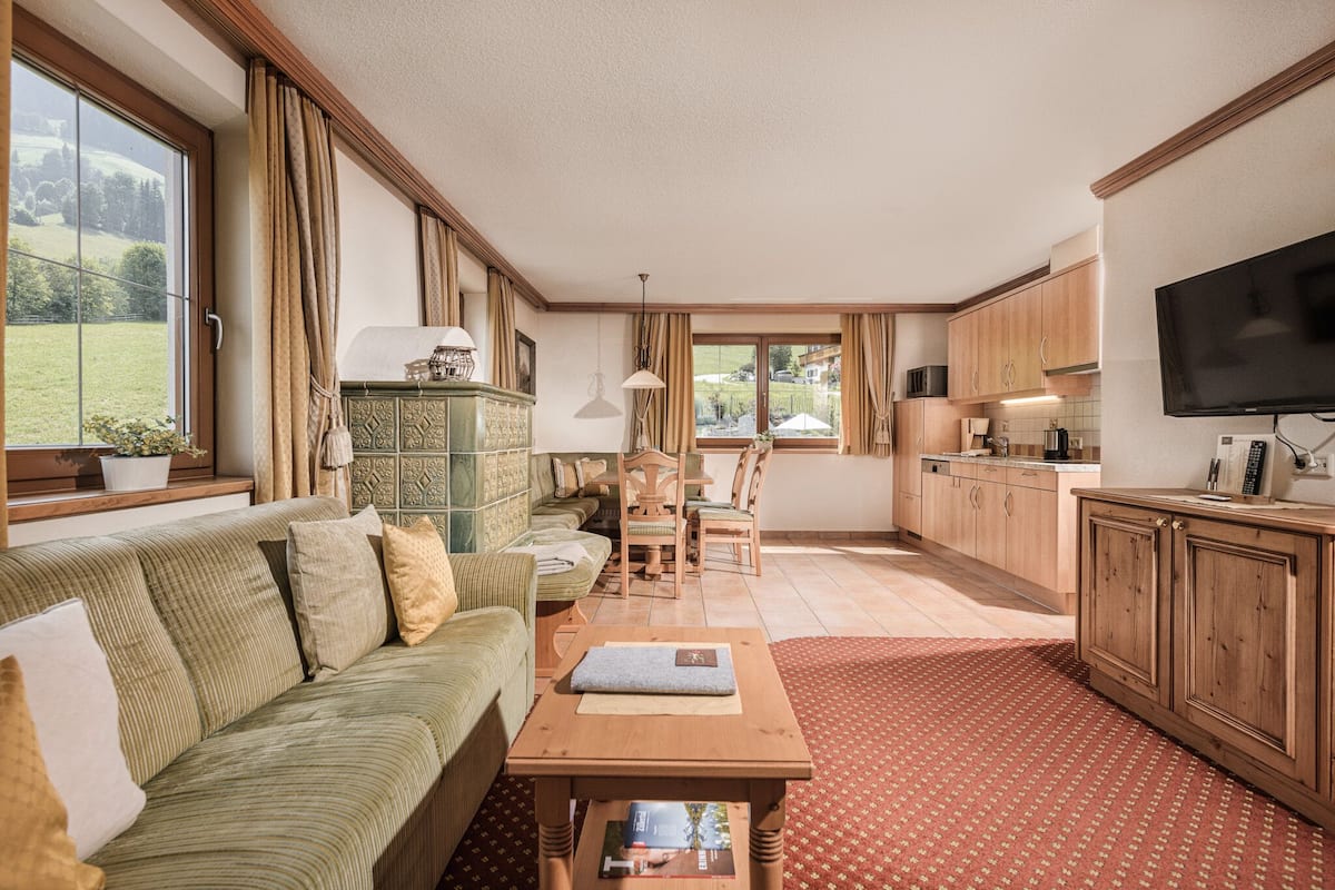 panoramic apartment, 2 bedrooms, balcony, mountainside | living area | flat-screen tv, toys