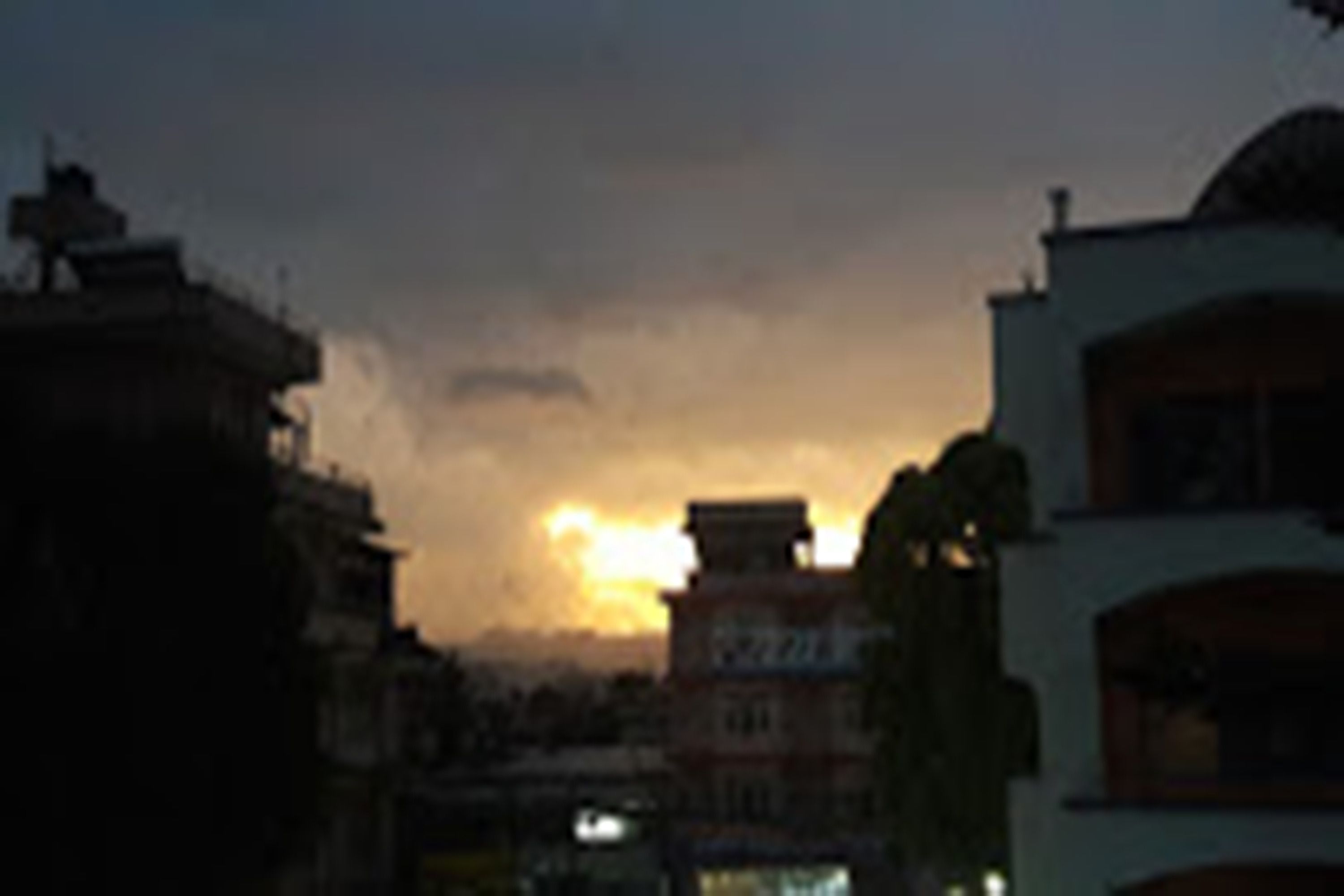 A building with a flat roof and a balcony.