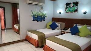 A hotel room with two beds, a mirror, an air conditioner, a wall clock, and a cartoon character decoration. - Golden Pine Hotel (Baguio)