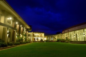 A modern hotel with a spacious courtyard, multiple floors, and well-lit exterior. - Ariana Hotel (Dipolog)