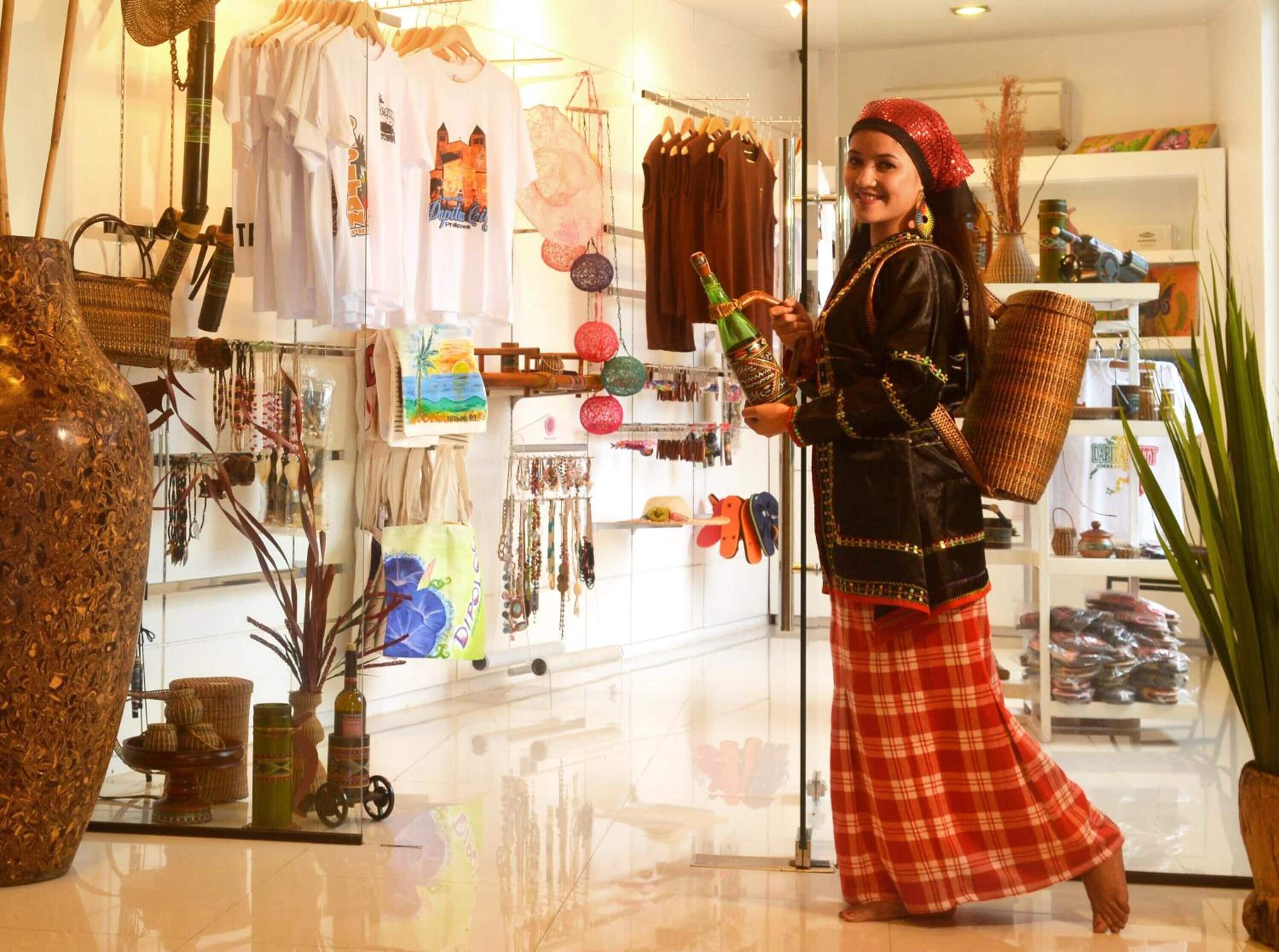A boutique with various items on display including clothing, accessories, and decorative objects.
