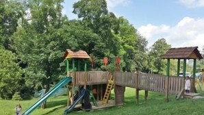 A playground with a slide, climbing structures, and a wooden bridge. - Vuglec Breg (Krapina)