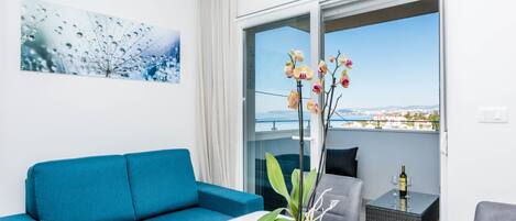 Luxury Apartment, 2 Bedrooms, Balcony, Sea View | In-room safe, desk, soundproofing, iron/ironing board
