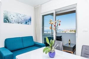 Luxury Apartment, 2 Bedrooms, Balcony, Sea View | In-room safe, desk, soundproofing, iron/ironing board