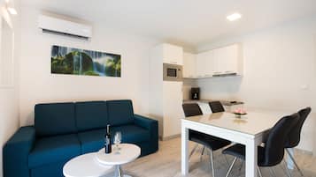 Luxury Apartment, 2 Bedrooms, Balcony, Sea View | In-room safe, desk, soundproofing, iron/ironing board