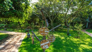 A wooden signpost with directional arrows and numbers indicating different sections or areas. - Camellia Resort and Spa (Avudangawa)