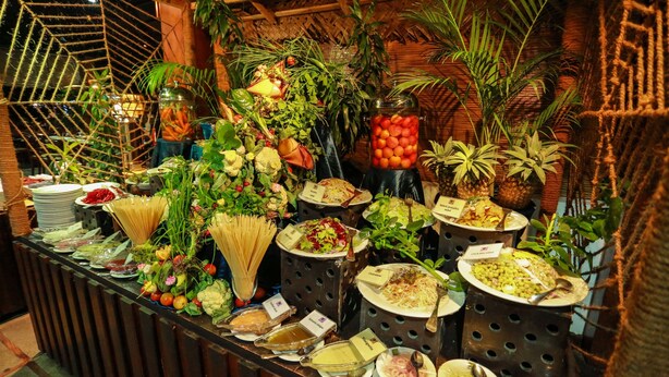 A buffet with various dishes and fresh fruits. - Camellia Resort and Spa (Avudangawa)