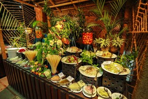 A buffet with various dishes and fresh fruits. - Camellia Resort and Spa (Avudangawa)