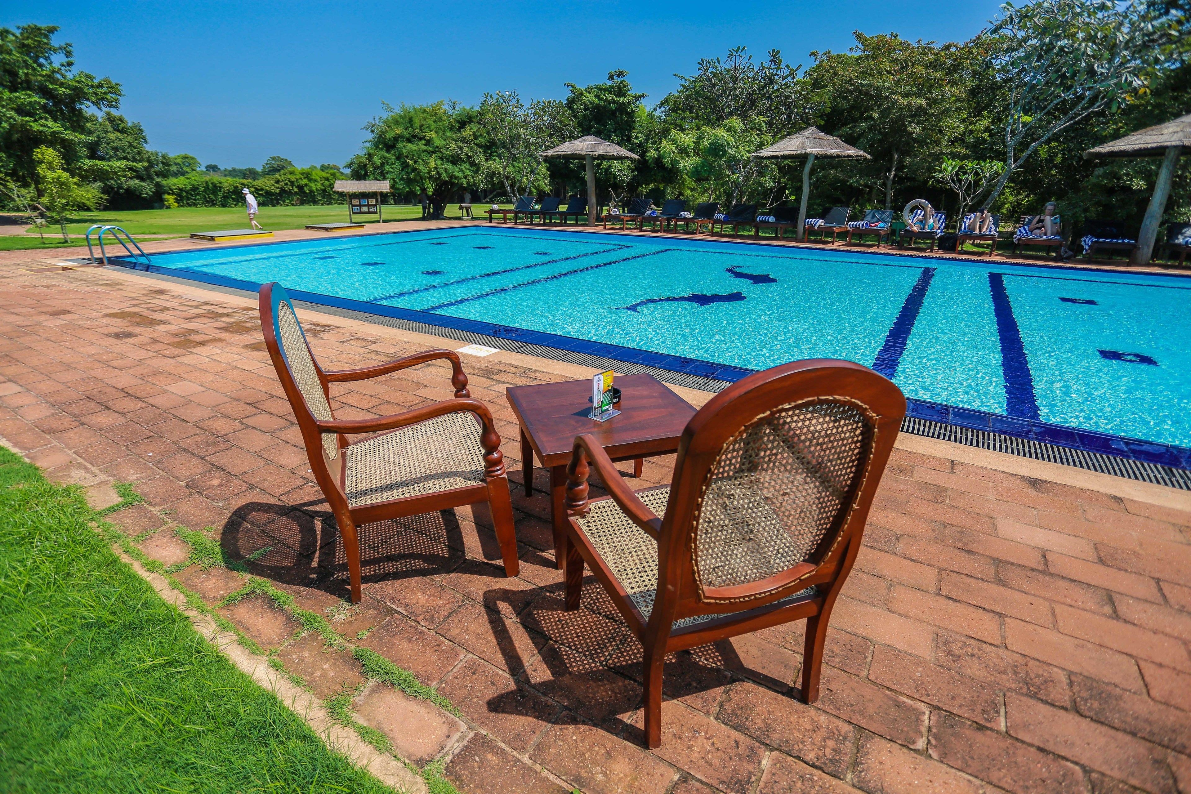 outdoor pool, pool umbrellas, pool loungers