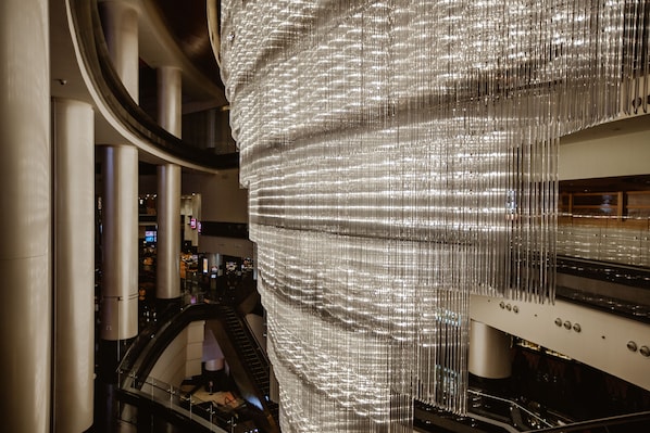 A modern interior with a large, shiny, vertical installation.