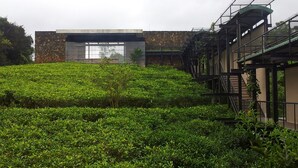 A modern building with a stone facade and a large glass window. - The Rainforest Ecolodge Sinharaja (Deniyaya)