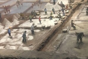 A busy construction site with workers engaged in various tasks. - Meiyuan Hotel (Ningbo)