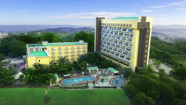 A hotel with multiple buildings, a swimming pool, and a tennis court. - Lorin Sentul Hotel (Bogor)