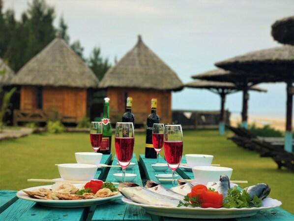 Romantic Chalet, 1 Bedroom, Non Smoking, Beach View | Outdoor dining | Breakfast, lunch, dinner served; international cuisine - Saint Mary Beach Resort (Phan Thiet)