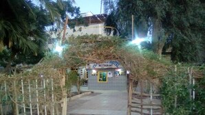An entrance to a hotel with a sign that reads "Hotel Restaurant." - Pharaohs Hotel (Luxor)