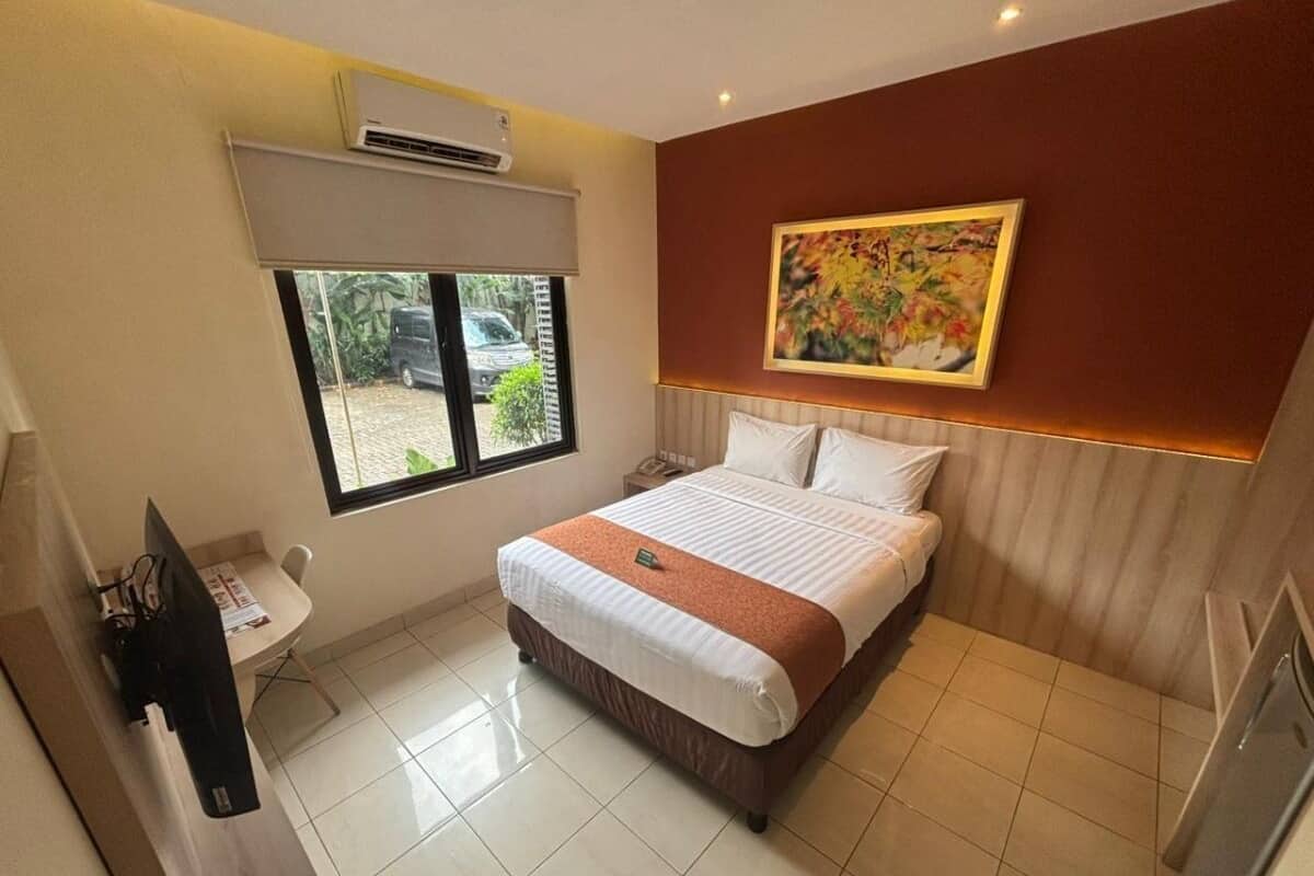 Desk, laptop workspace, blackout drapes, iron/ironing board