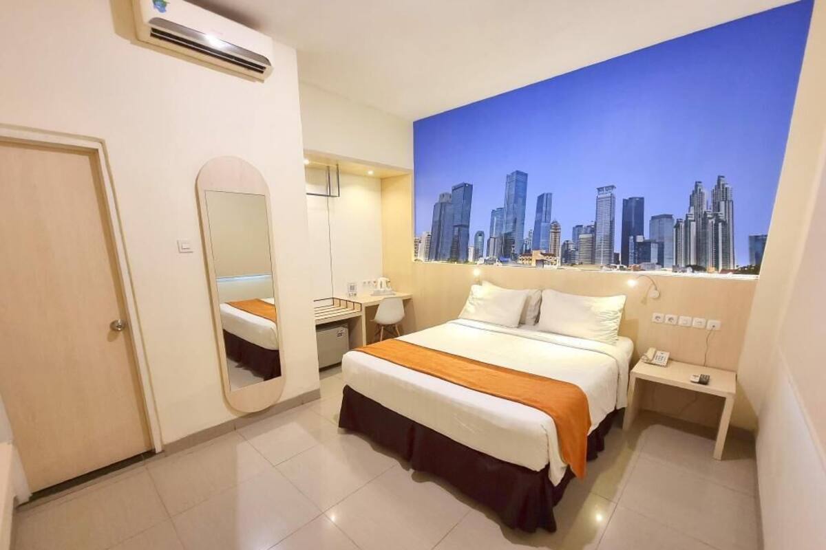 Desk, laptop workspace, blackout drapes, iron/ironing board