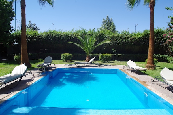 Outdoor pool, pool umbrellas, sun loungers