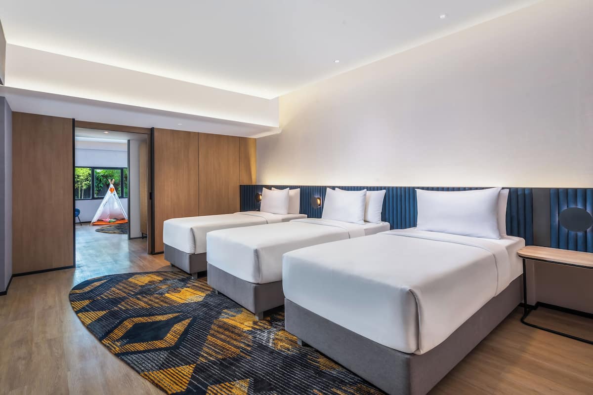 Family Room, 2 Double Beds | Minibar, desk, iron/ironing board, free WiFi