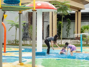 A water play area with colorful structures and a pool. - Novotel Pontianak Convention Centre (Pontianak)