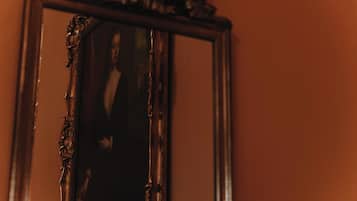 A mirror with a damaged frame.