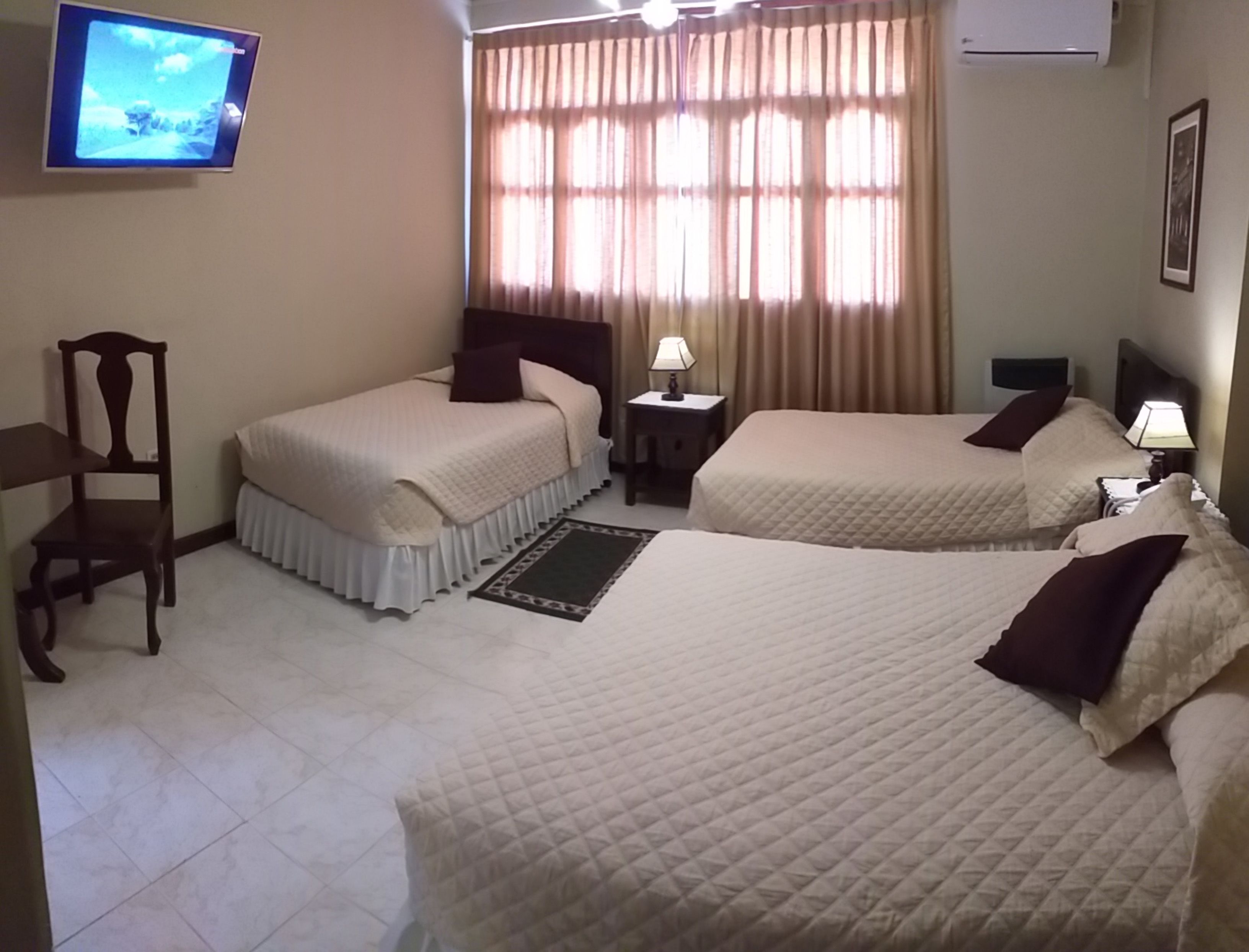 superior triple room | laptop workspace, blackout curtains, wifi, bed sheets
