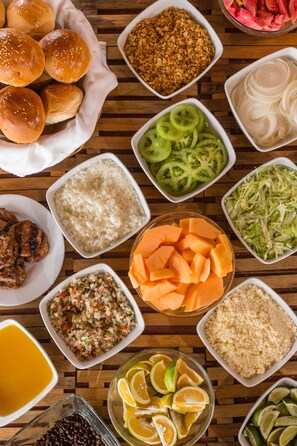 A variety of food items including buns, rice, vegetables, and meat. - Decameron Las Heliconias (Quimbaya)