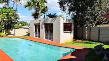 Outdoor pool, pool umbrellas, sun loungers