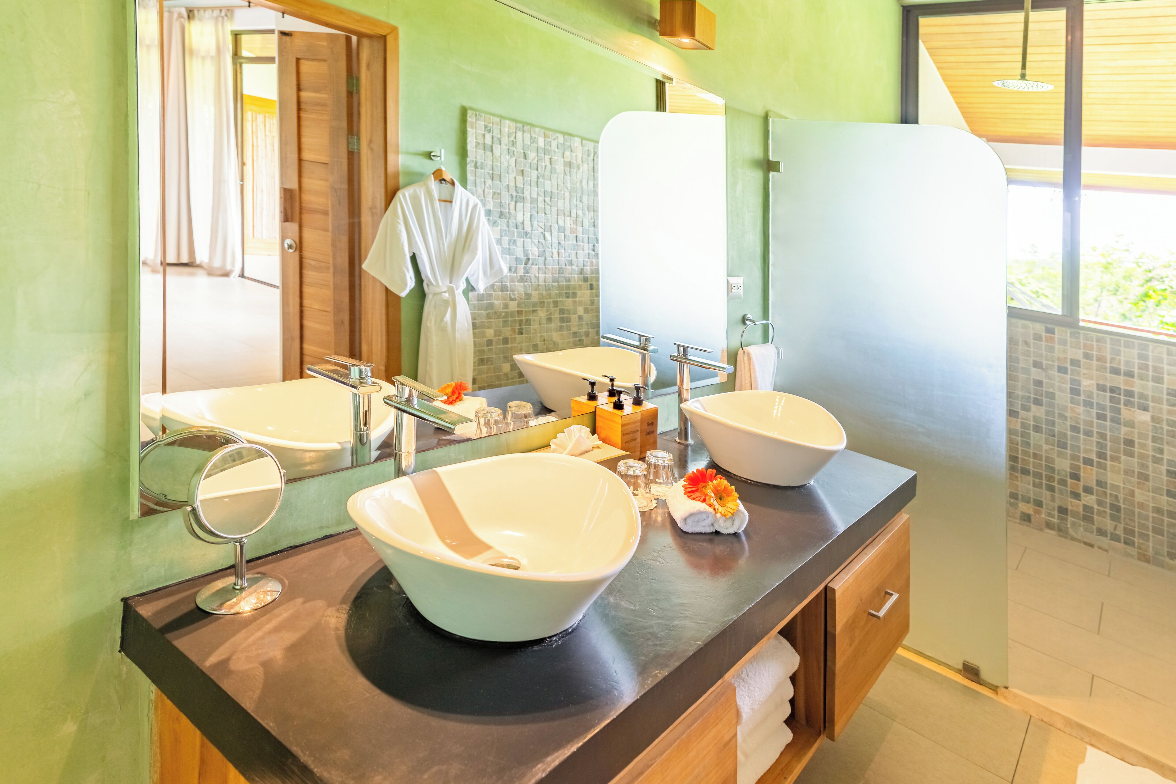 suite (jungle, one king bed) | bathroom | shower, rainfall showerhead, eco-friendly toiletries, hair dryer
