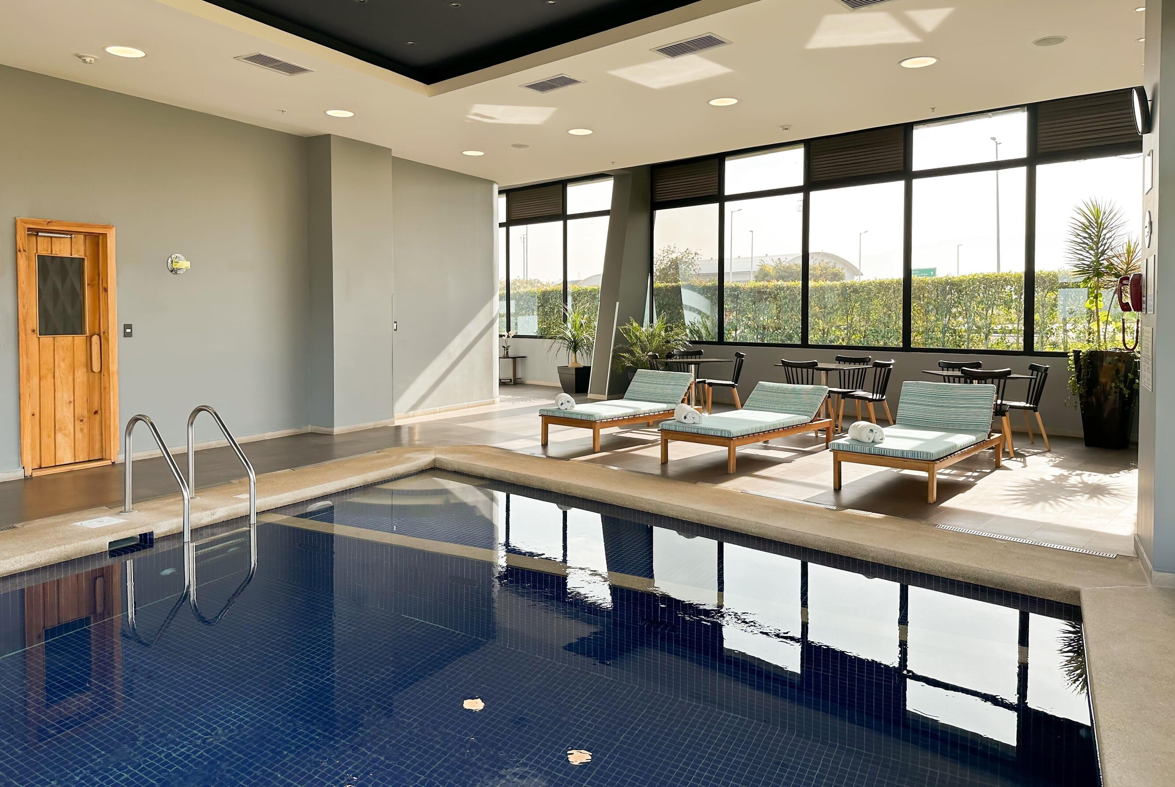 Indoor pool, open 7:00 AM to 10:00 PM, sun loungers