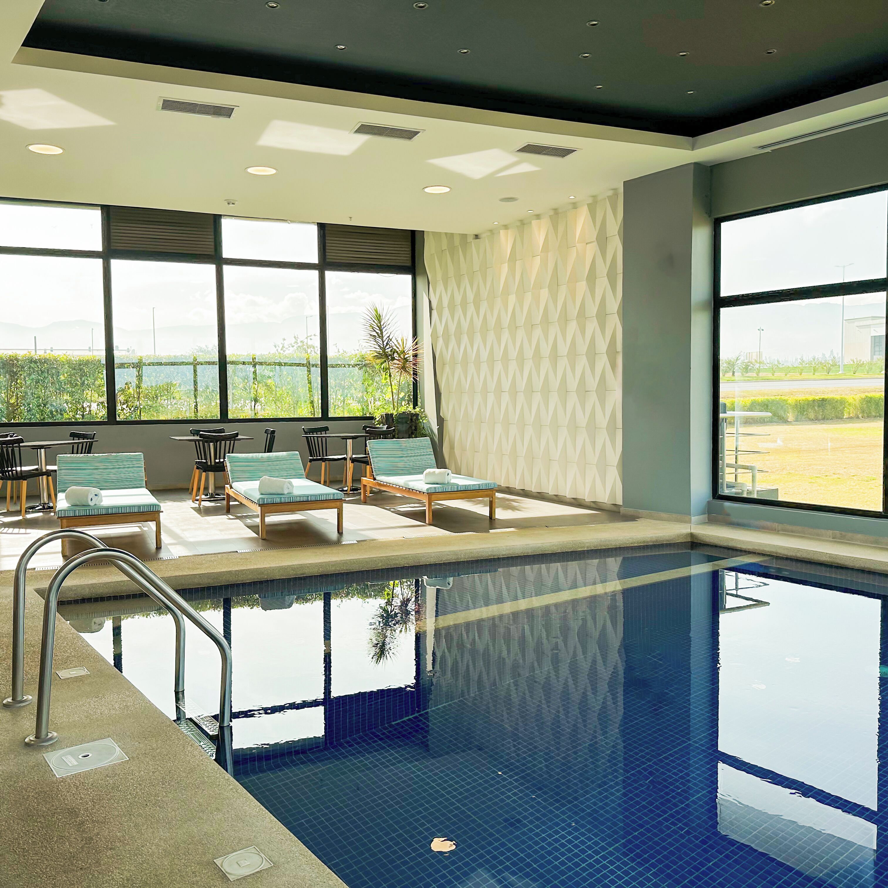 indoor pool, open 7:00 am to 10:00 pm, pool loungers