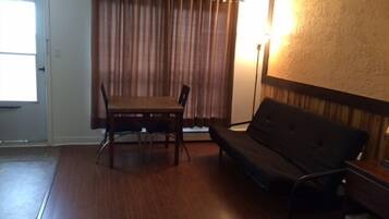 Standard Room, 1 Queen Bed, Kitchenette | Living area | Flat-screen TV