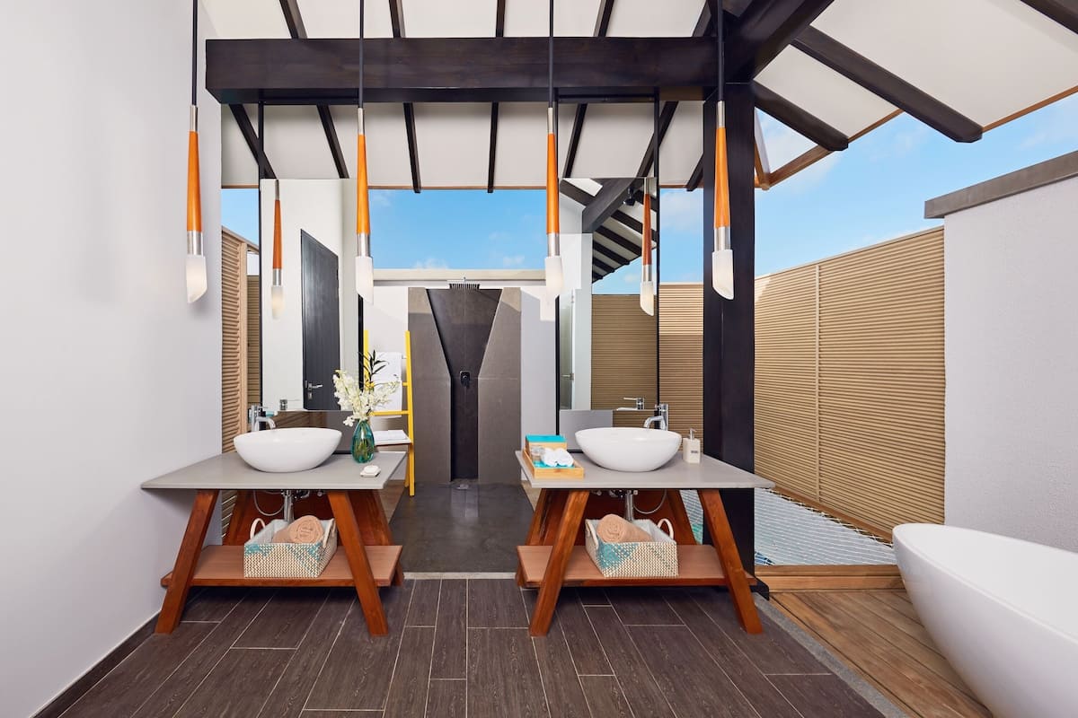 over water pool suite | bathroom | separate bathtub and shower, deep-soaking bathtub, free toiletries