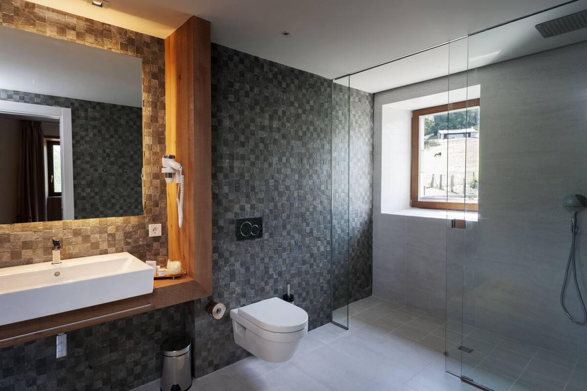 shower, rainfall showerhead, hair dryer, towels