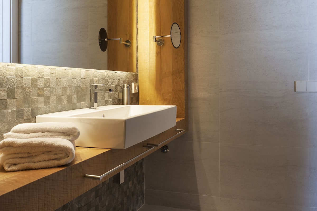 shower, rainfall showerhead, hair dryer, towels