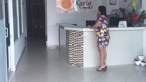 A hotel reception desk with a sign reading "Karin Hotel". - Karin Hotel (Riohacha)