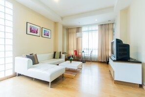 1 Bedroom F  | Living area | Flat-screen TV
