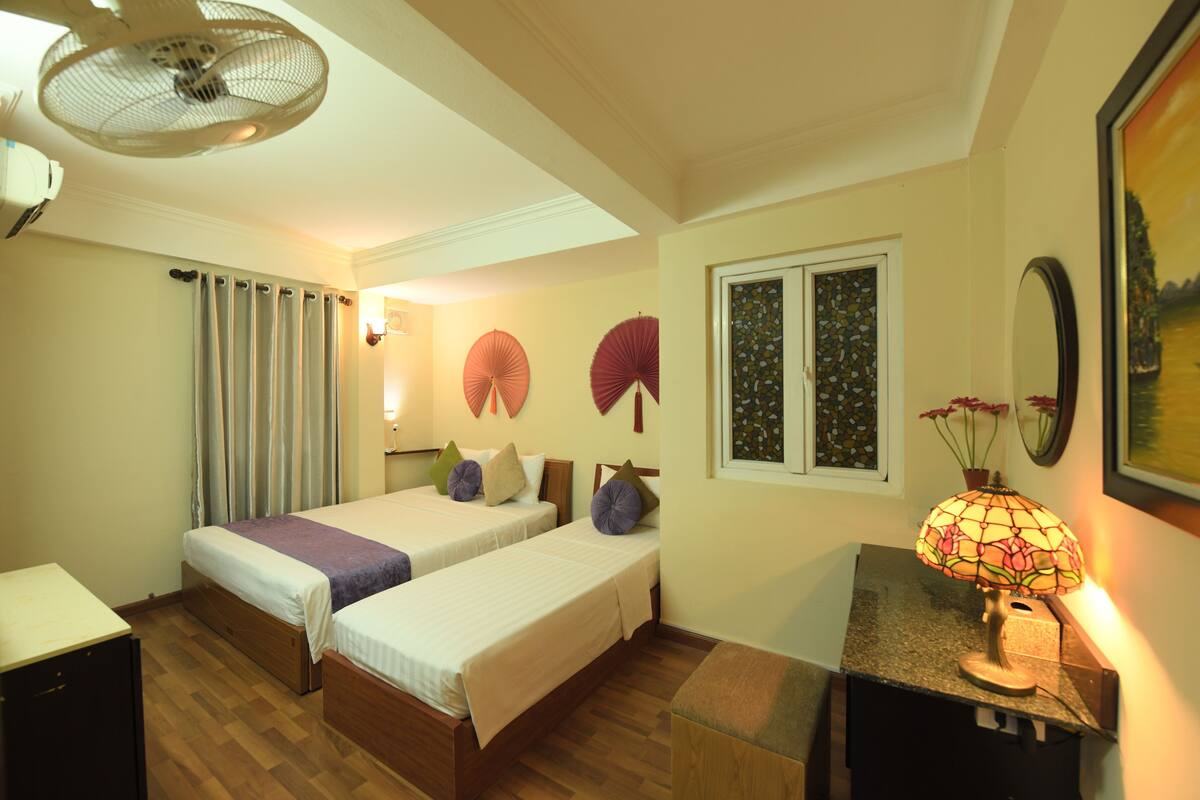 Superior Triple Room | Minibar, in-room safe, desk, blackout drapes