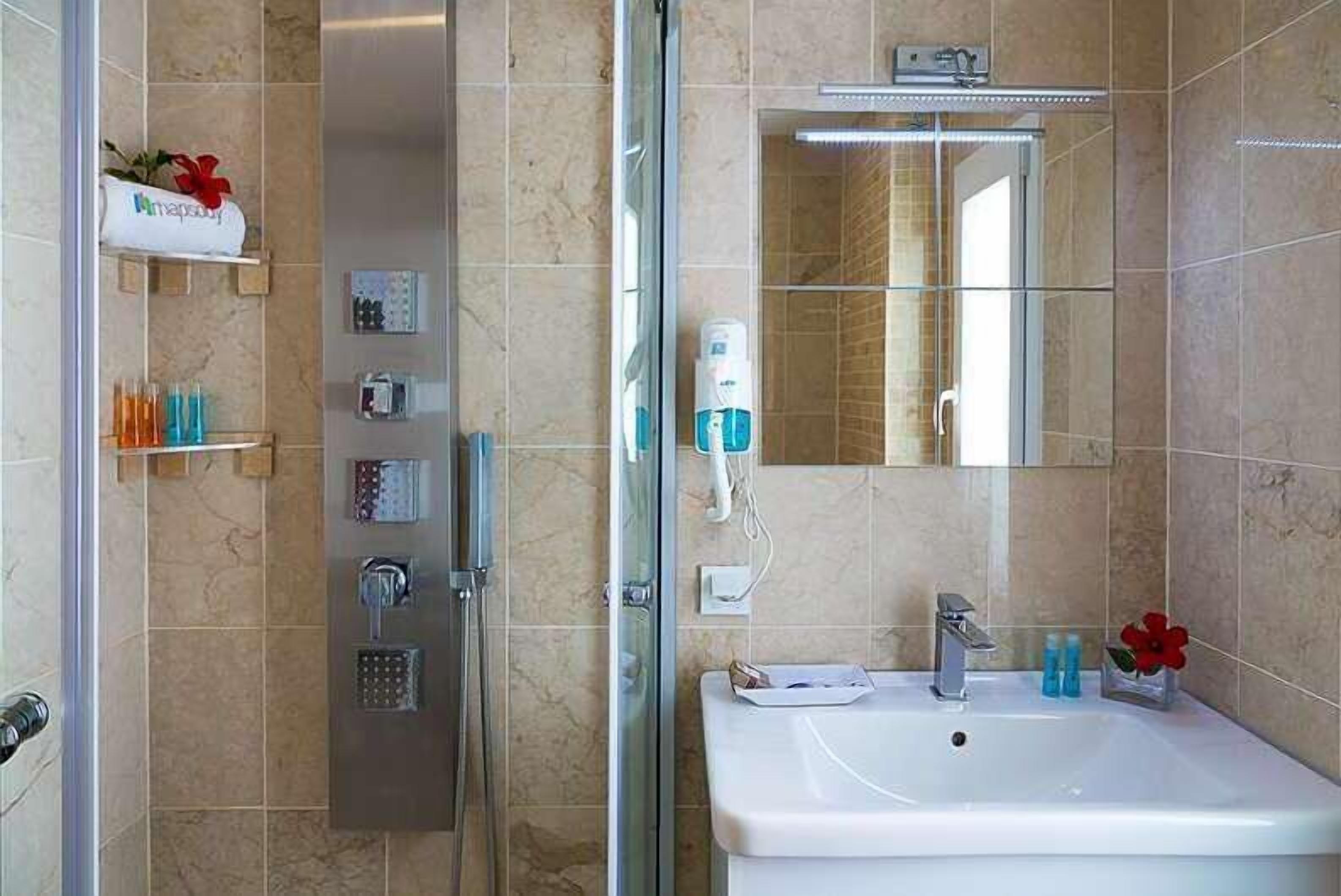 family room, jetted tub, sea view | bathroom | shower, free toiletries, hair dryer, slippers