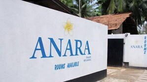 A sign for 'ANARA BLUE TROPICAL' with 'ROOMS AVAILABLE' written below. - Anara Villa (Unawatuna)