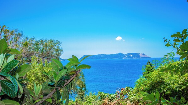 A coastal landscape with a clear view of the sea and distant mountains. - Kas Maki Hotel (Kas)
