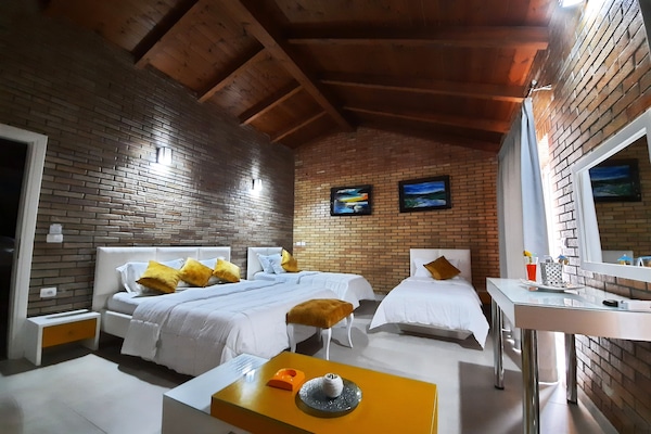 Deluxe Suite, Balcony | 1 bedroom, desk, free WiFi