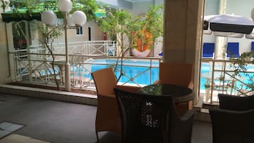 Outdoor pool, pool umbrellas, sun loungers
