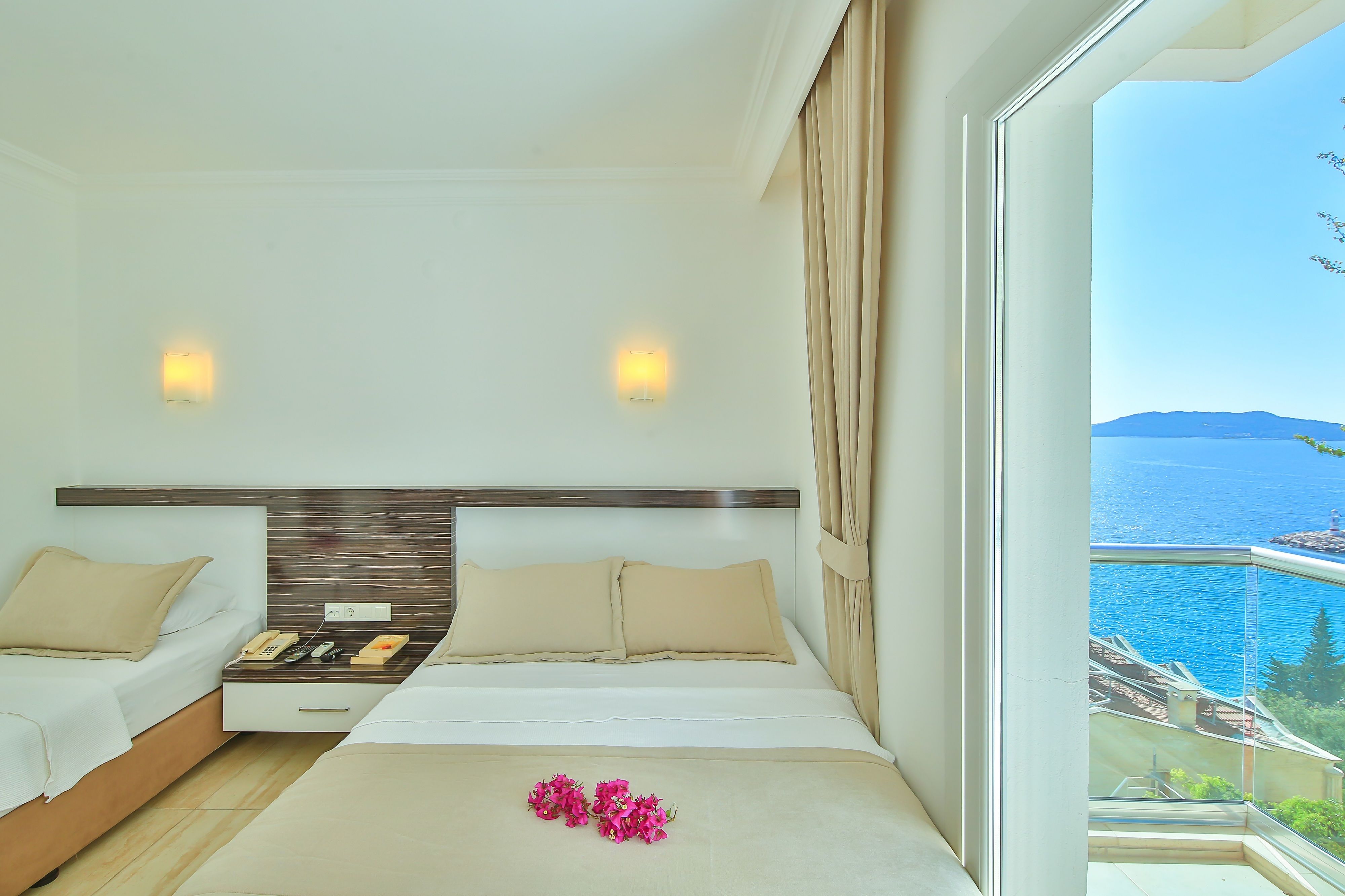 triple room, partial sea view | view from room