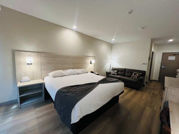 Chambre Deluxe, 1 très grand lit, non-fumeurs | Bureau, fer et planche à repasser, Wi-Fi gratuit, draps fournis