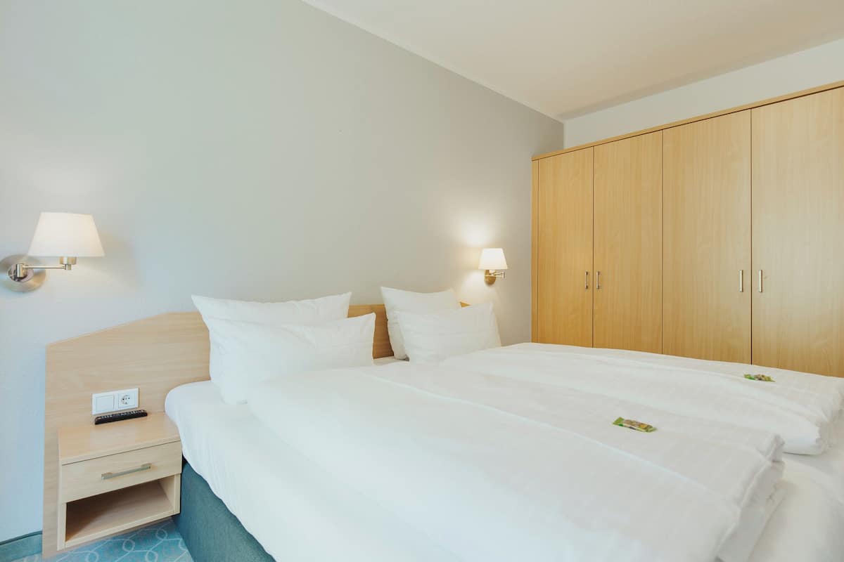 Junior Apartment, Balcony, Park View | Minibar, in-room safe, desk, blackout drapes