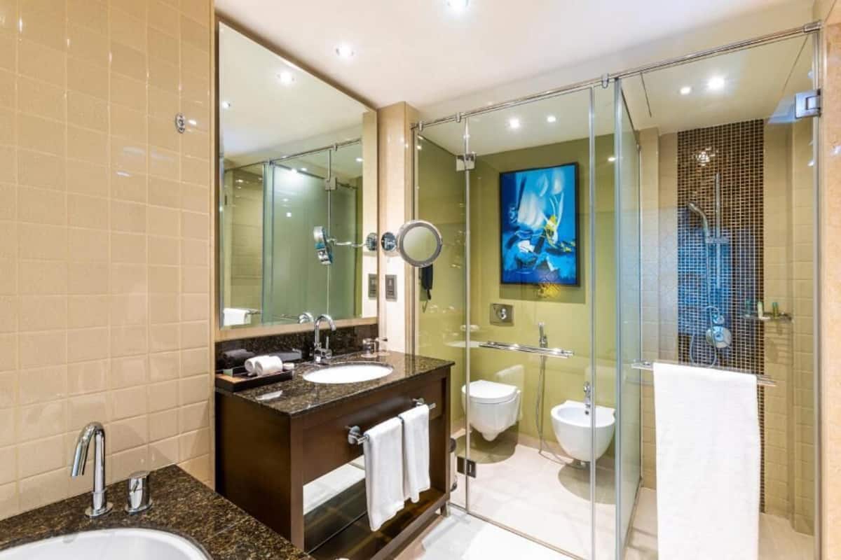 Bathroom | Separate bathtub and shower, rainfall showerhead, free toiletries
