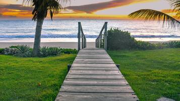 Beach nearby, white sand, beach towels
