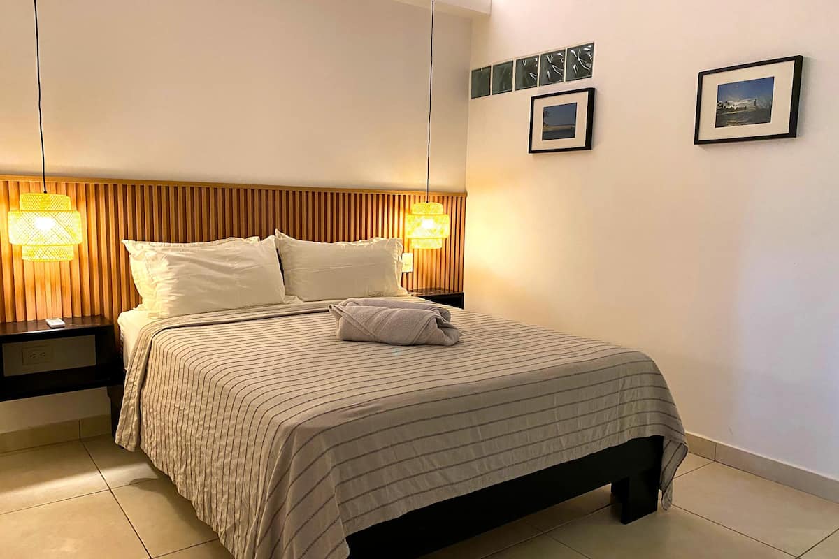 Standard Apartment, 1 Bedroom, Garden View | 1 bedroom, in-room safe, desk, laptop workspace